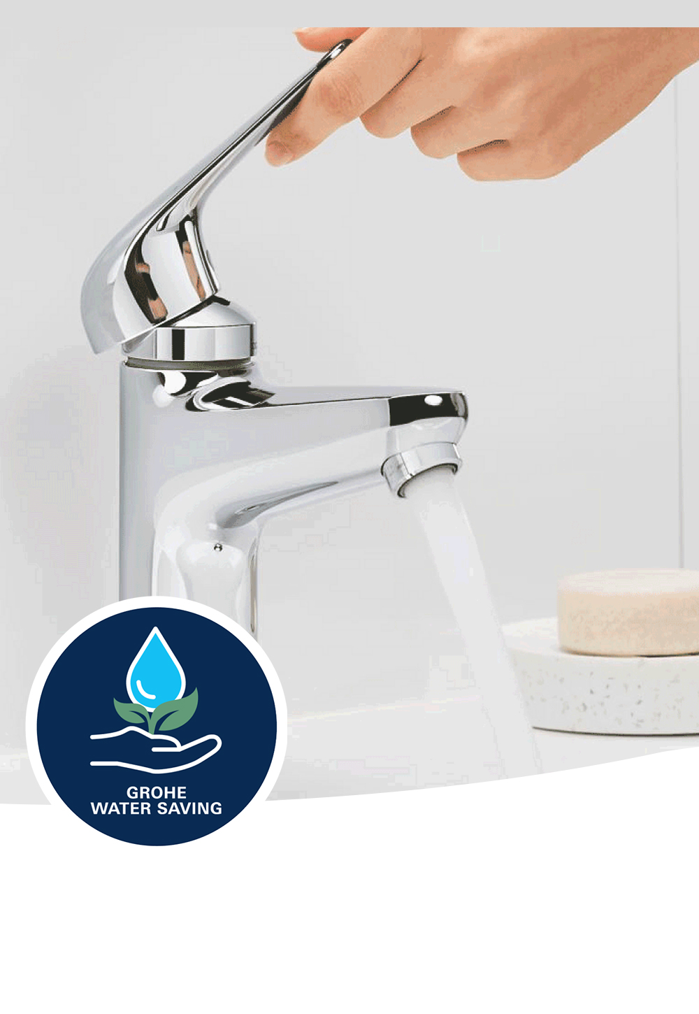 A GROHE Swift basin mixer turned on full, a soap dish placed on the sink in the background